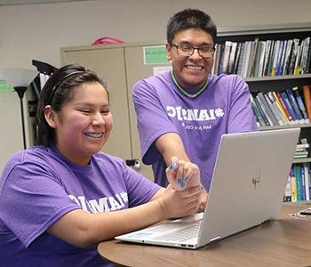 students working at a computer